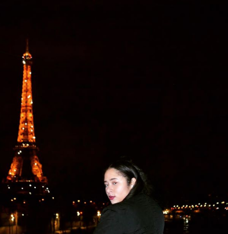 Student in front of Eiffel Tower