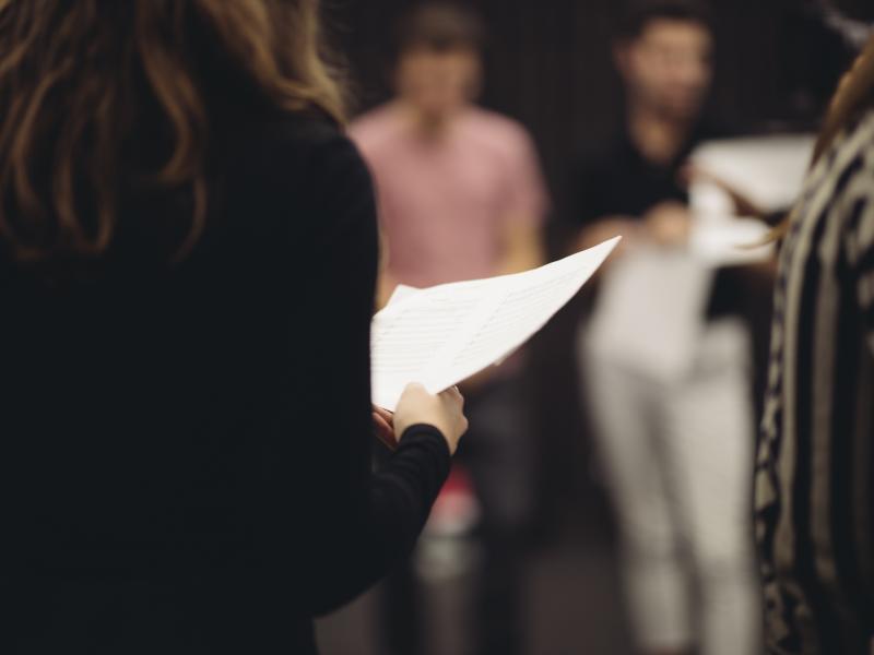 Close up of student holding a piece of paper