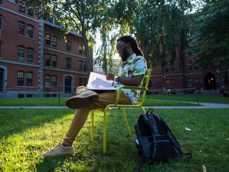 Student studying in Harvard Yard