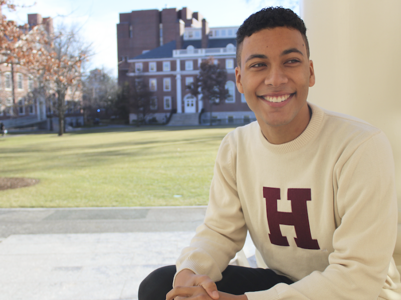 Student sitting in Radcliffe Yard