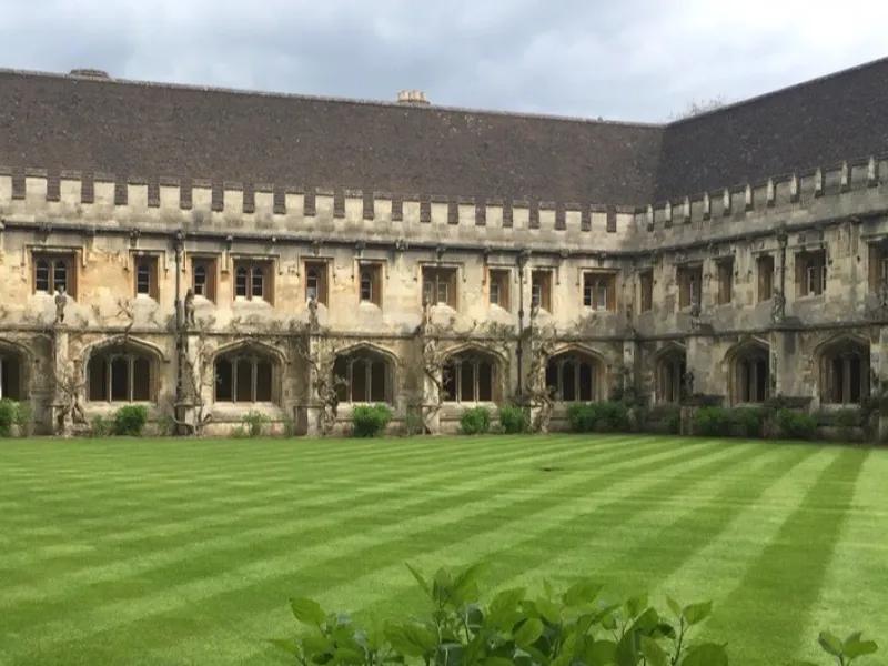 Manicured lawn in front of an old building