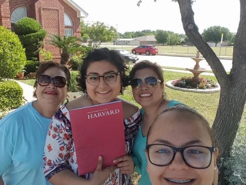 My family and I showing off my Harvard admitted student packet