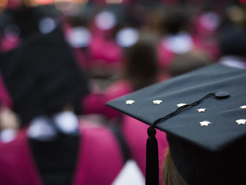 student wearing cap and gown