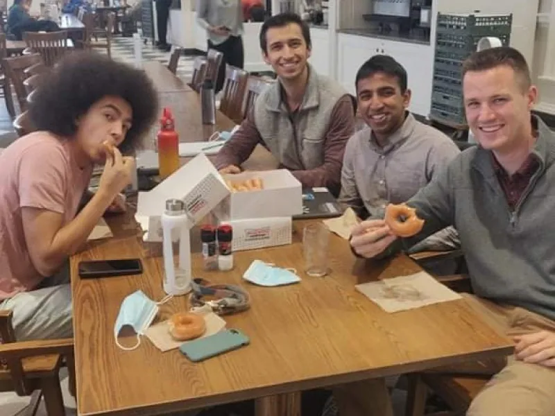 Picture of myself and three friends in Leverett Dining Hall