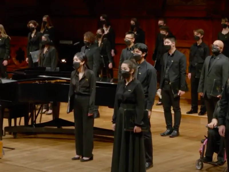 A picture of the Harvard-Radcliffe Collegium Musicum singing at Reunion: A Fall Concert.
