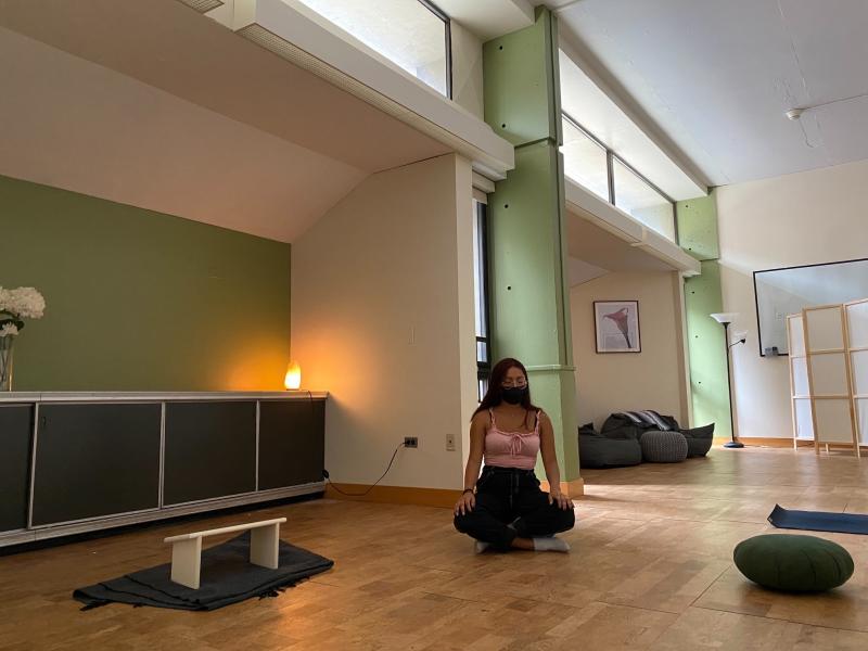 A student meditating in the Mather Tranquility Room.