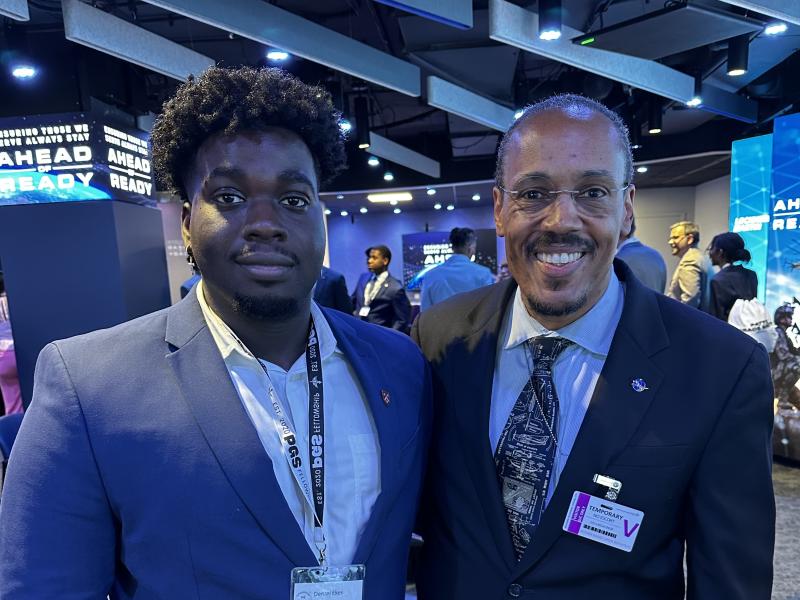 Denzel Ekes and Astronaut Benjamin Alvin Drew pictured together smiling at the camera.