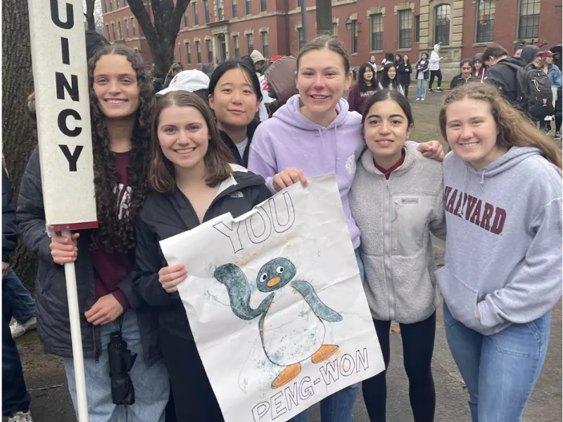Blocking group posed with Quincy signs 