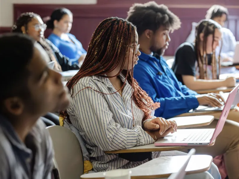 Students taking notes in class