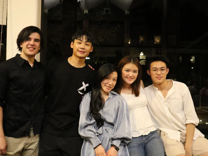 Four students and a returning alumni at a TCS event