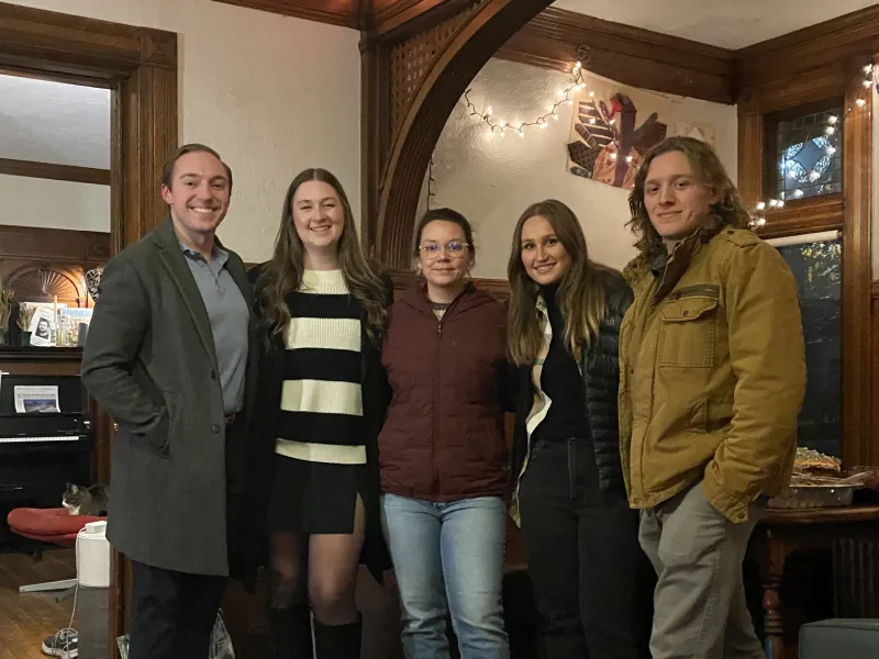 Quinn posing for a group photo with his friends during Thanksgiving