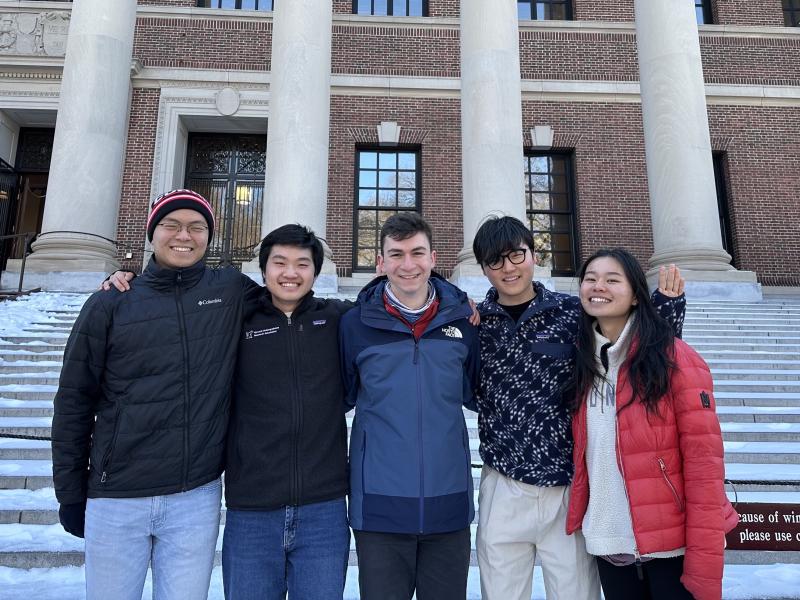 Picture of Raymond and his blocking mates standing in front of the steps of Widener Gate.