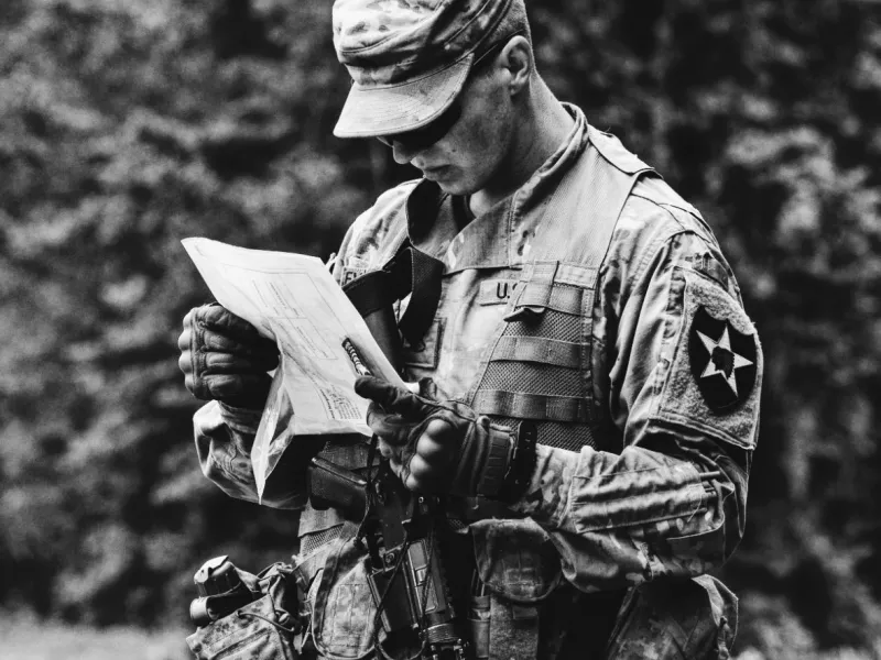 Soldier analyzes paper