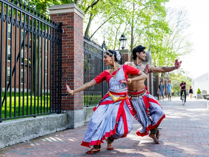 Anugraha Raman ’12 (left) and Kohal Das warm up for their performance on Science Center Plaza.