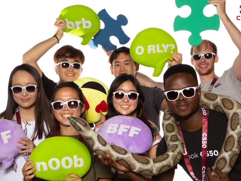 Photo booth photo of Inno and other staff cohort members at the fall 2022 Puzzle Day.