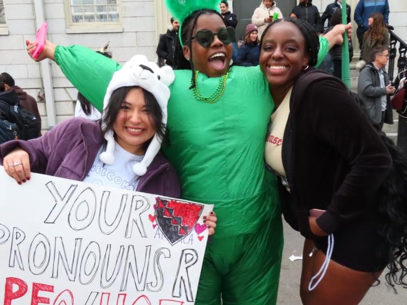 3 girls happily posing in Harvard Yard during Housing Day 2025. 