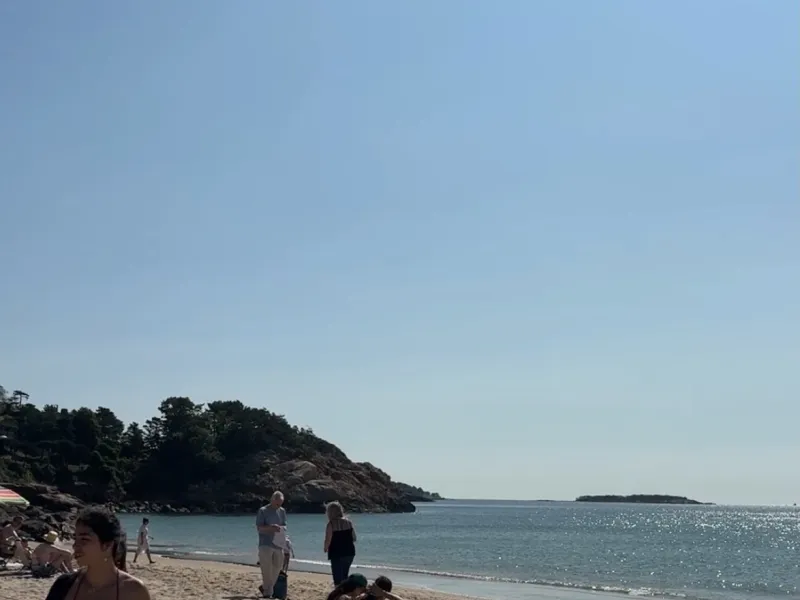 Beach with girl in corner of photo