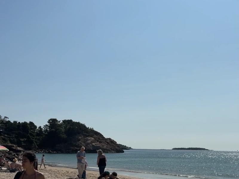 Beach with girl in corner of photo