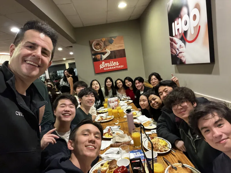 Group photo of CS50 Hackathon group at IHOP Breakfast
