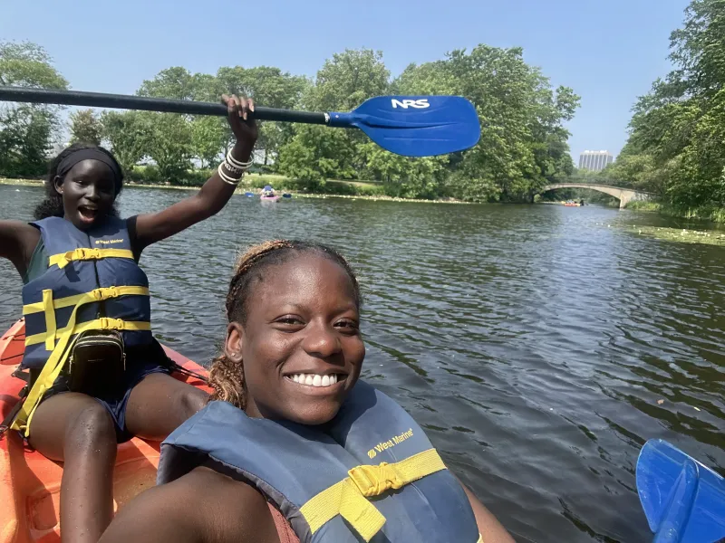 My co-worker Nyankiir and I kayak down the Charles River.