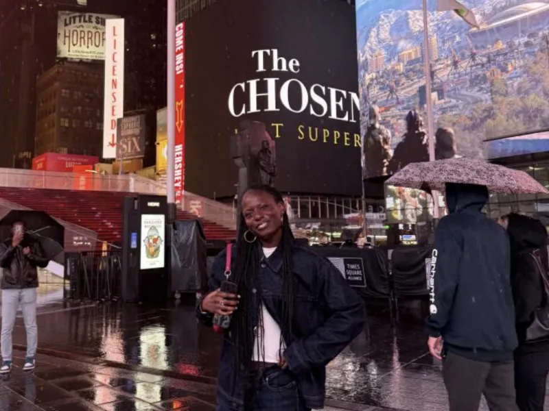 I smile for a photo at Times Square in New York City.