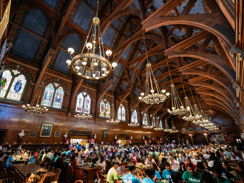 The inside of Annenberg Hall is full of students dining.