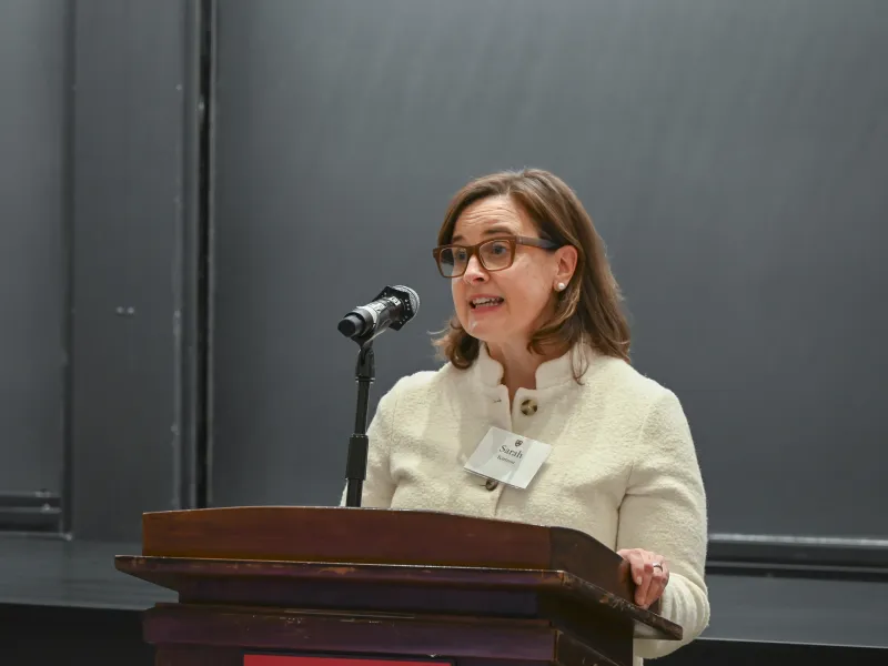 HAA Executive Director Sarah C. Karmon delivering remarks at the podium.
