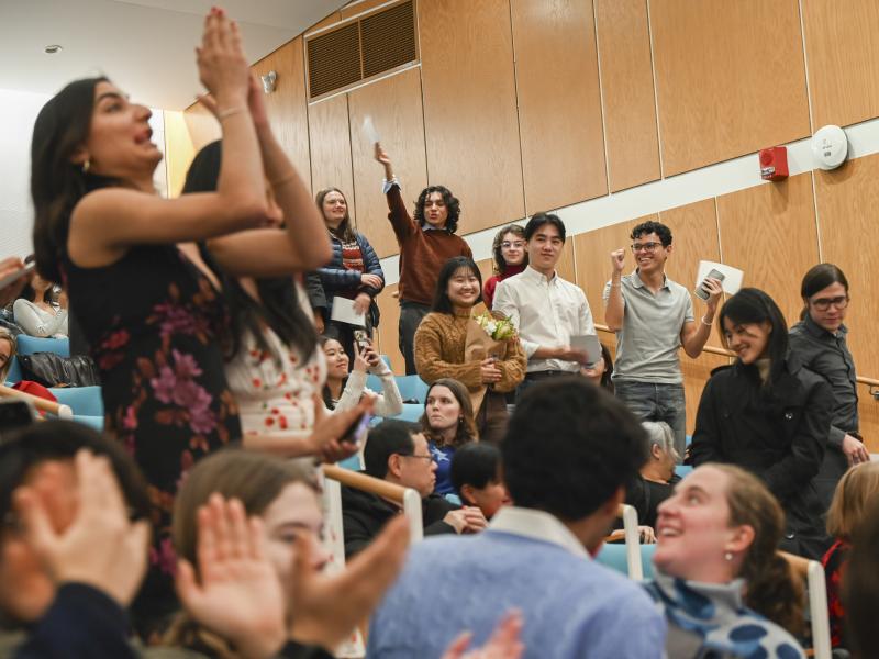 The room erupts with cheers as the graduates recieve their diplomas.