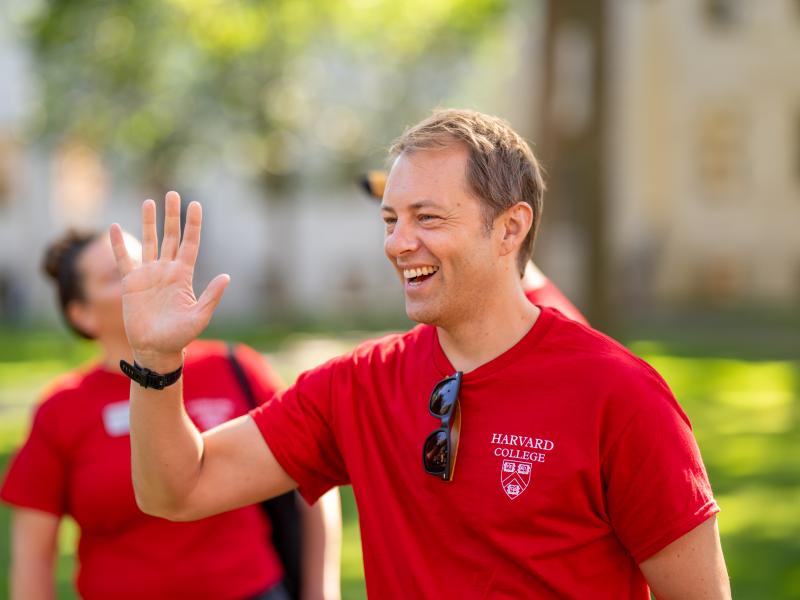 Dean David Deming offering a high five during move-in day.