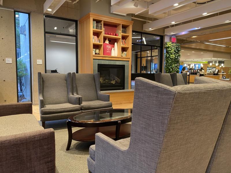 Four gray chairs arranged in a square.