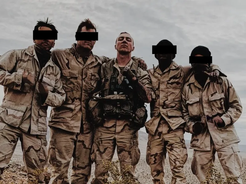 A group of soldiers pose for a picture during a training exercise