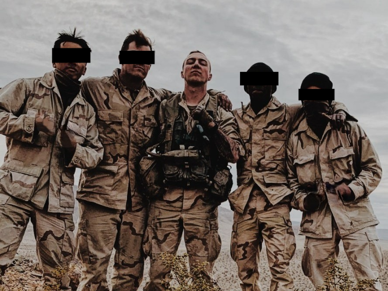 A group of soldiers pose for a picture during a training exercise