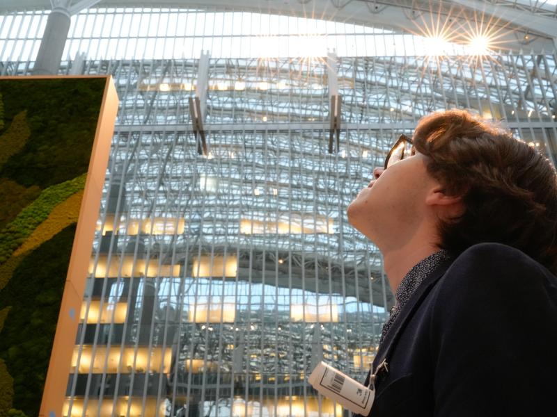 Student Connor looking upward in amazement at the rooftop.