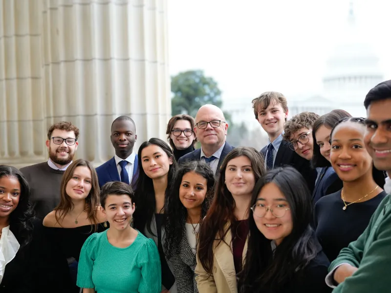 The students taking a picture with Massachusetts Representative Jim McGovern.