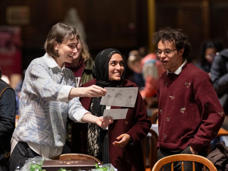 Students looking at photos together.