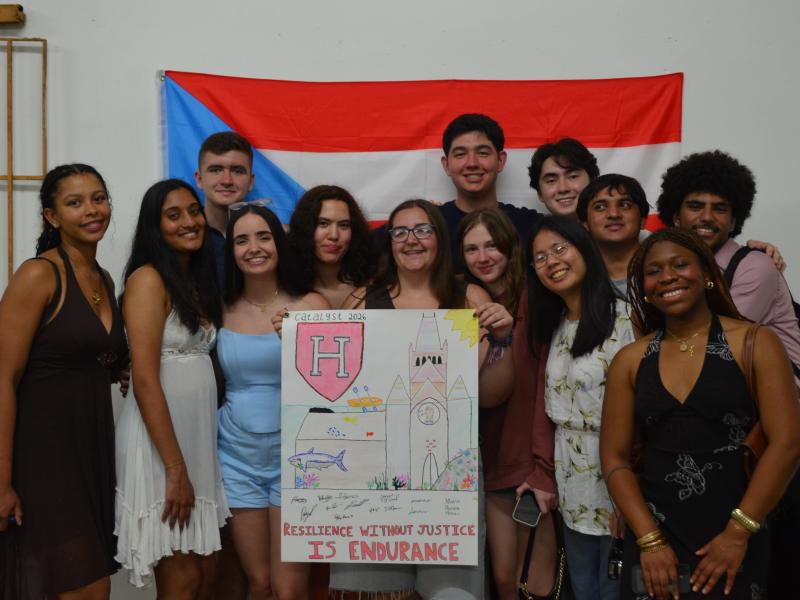 The group of Catalyst students posing with a poster they designed to commemorate their week of service in Puerto Rico.