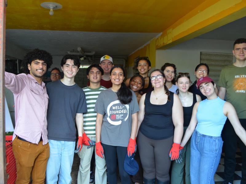 The Catalyst cohort poses in front of the house of a local community member following a day of house repair and restoration.