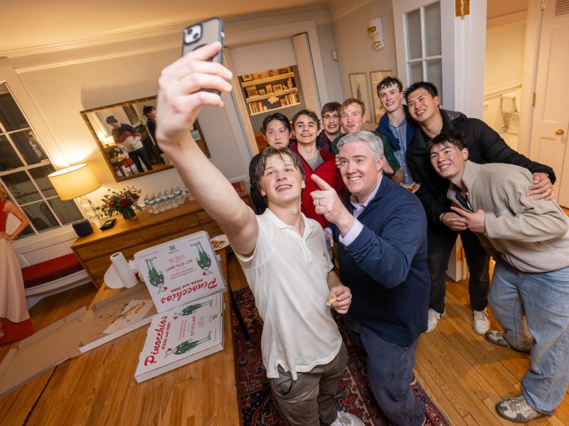 Students taking a selfie with Dean Dunne.