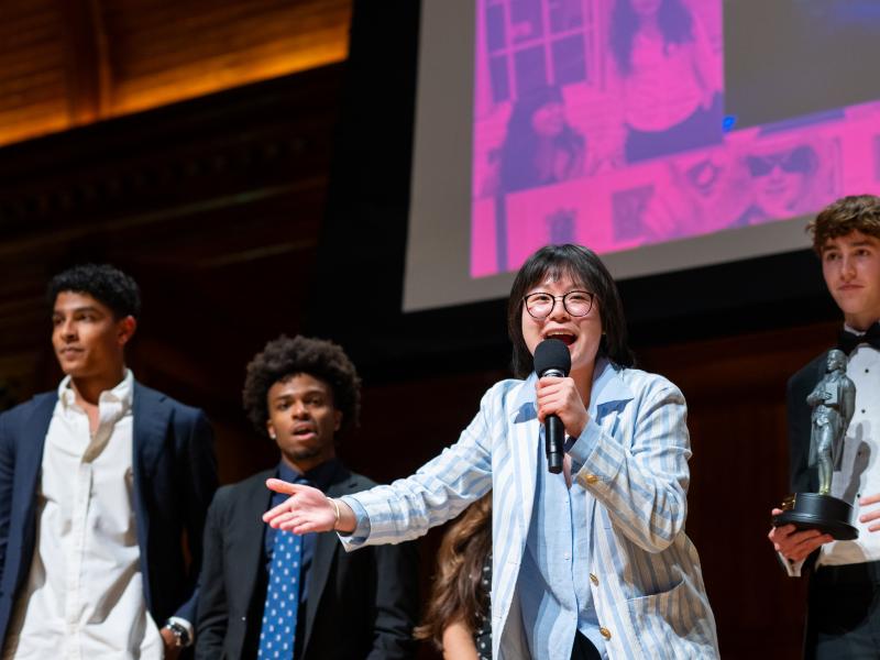 Members of Lowell House onstage accepting an award.