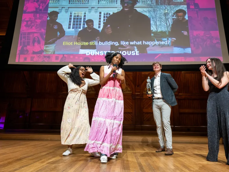 Students of Dunster House onstage accepting the Best Lyrics award.