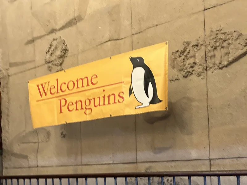 A sign saying "Welcome Penguins" as you walk up the stairs to the Quincy House Dining Hall