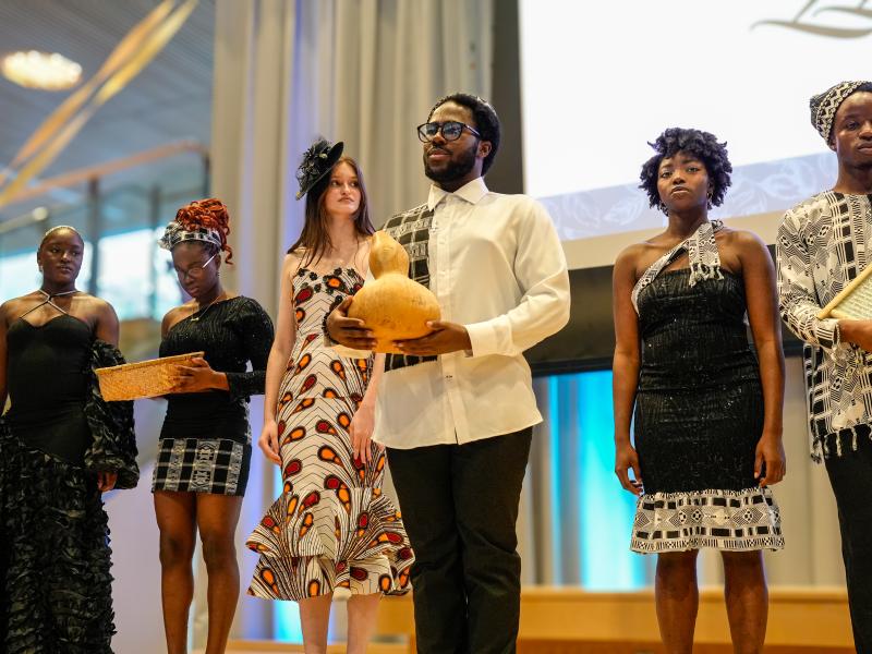 Omo Naija x the Wahala Boys: Harvard Undergraduate African Dance Troupe members dressed onstage in custom pieces by International fashion Designer Catarina Abreu, LLeya P, that reflect her Cape Verdean heritage at the Cultural Rhythms Fashion Show. 