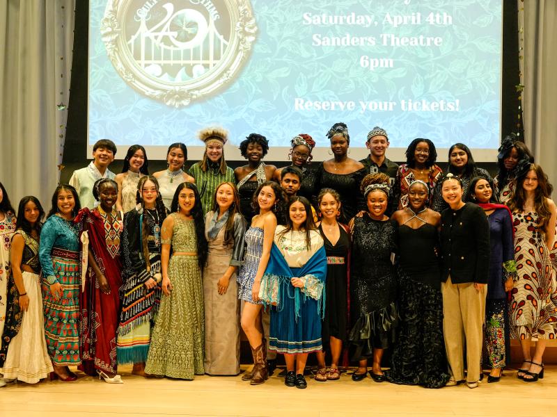 The group of Harvard students who walked the runway during the show, standing together onstage. 