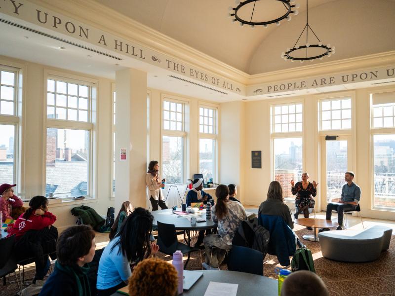 Wideshot of the Beren Rooftop Room of Winthrop House full of session participants.