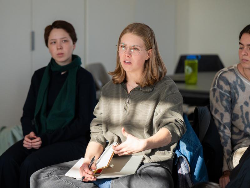 Closeup of student Halianna '28 participating in the group discussion.