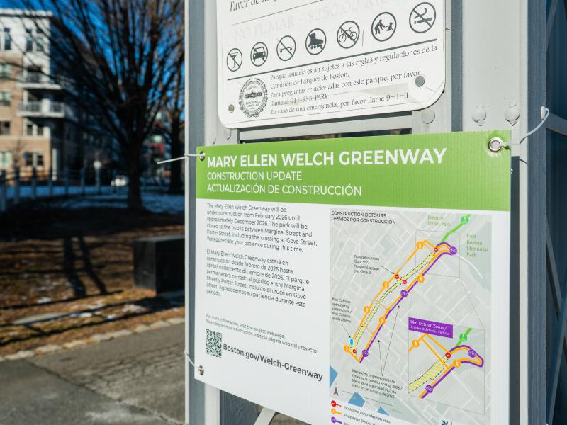 Closeup of a sign that reads "Mary Ellen Welch Greenway".