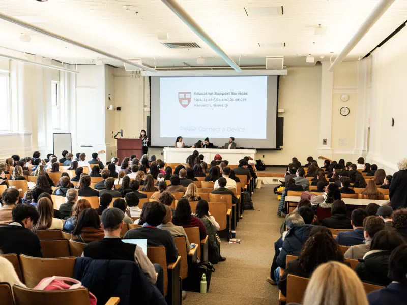 Students seated in large full lecture hall 