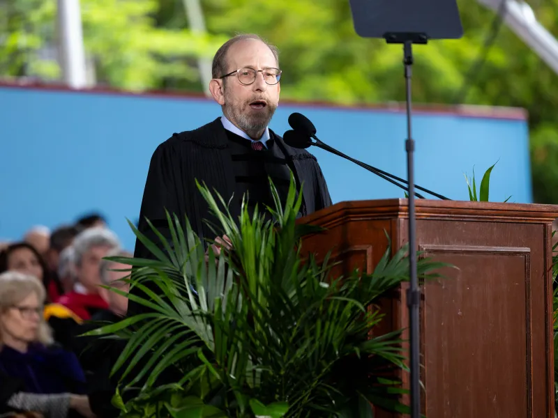 Harvard University President Alan Garber speaking onstage.