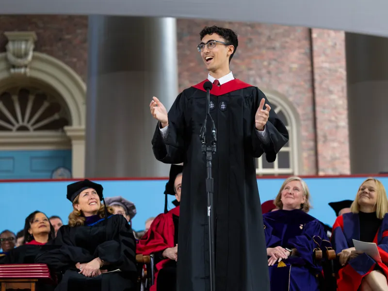 Noah Eckstein '26 talking onstage during the ceremony.