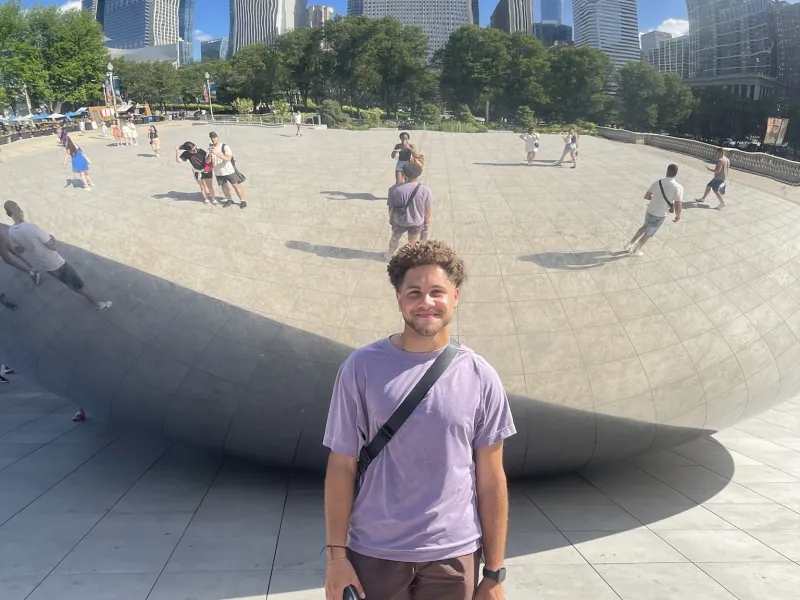 Eli Standing in Front of The Bean in Chicago